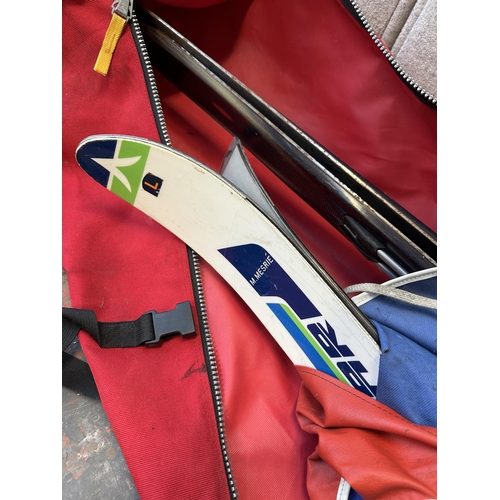 745 - Two cased pairs of skis, one Salomon 900S with pair of Scott Edge poles and one Dynastar