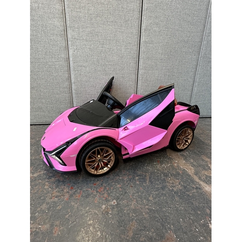 746 - A Toyzz pink Lamborghini electric child's ride on car