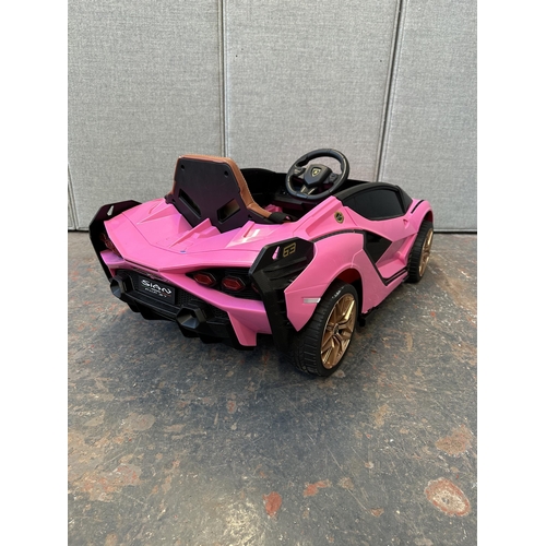 746 - A Toyzz pink Lamborghini electric child's ride on car