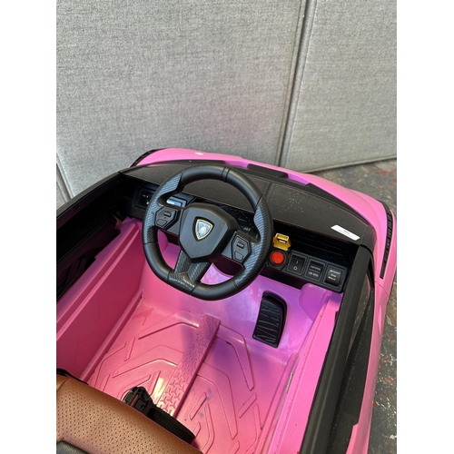 746 - A Toyzz pink Lamborghini electric child's ride on car