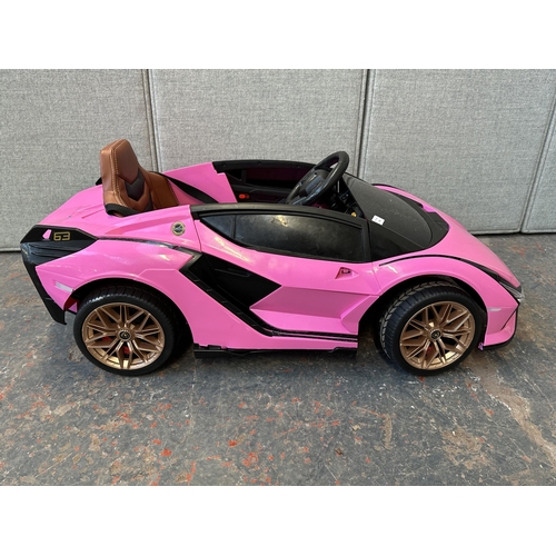 746 - A Toyzz pink Lamborghini electric child's ride on car