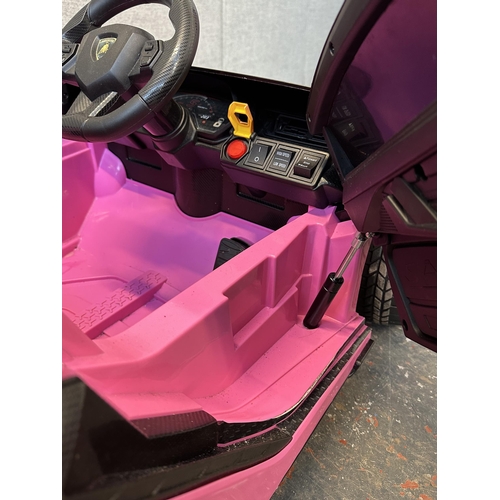 746 - A Toyzz pink Lamborghini electric child's ride on car