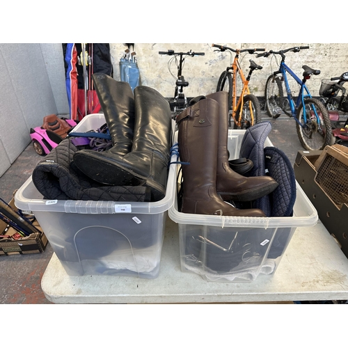 748 - Two boxes containing horse riding equipment to include pair of Gallop brown leather size 4 boots, st... 