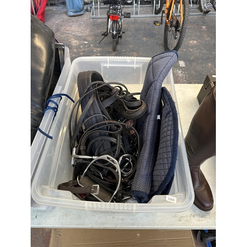 748 - Two boxes containing horse riding equipment to include pair of Gallop brown leather size 4 boots, st... 