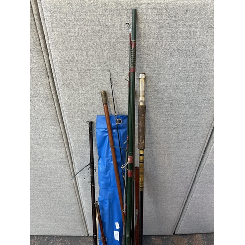 751 - A collection of vintage fishing rods to include split cane etc.