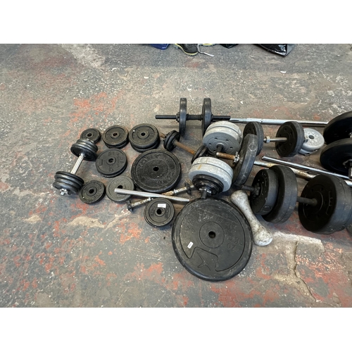 758 - A collection of weightlifting equipment to include York barbell weights, pair of TNP 5kg dumbbells e... 