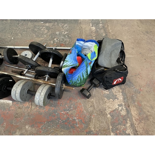 758 - A collection of weightlifting equipment to include York barbell weights, pair of TNP 5kg dumbbells e... 