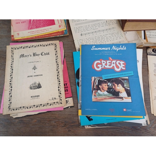 683 - A collection of antique and vintage sheet music to include Annie's Song, Summer Nights, Three Times ... 