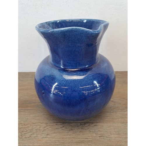 324A - An early 20th century Fremington Pottery Barnstaple blue glazed terracotta jug - approx. 19cm high