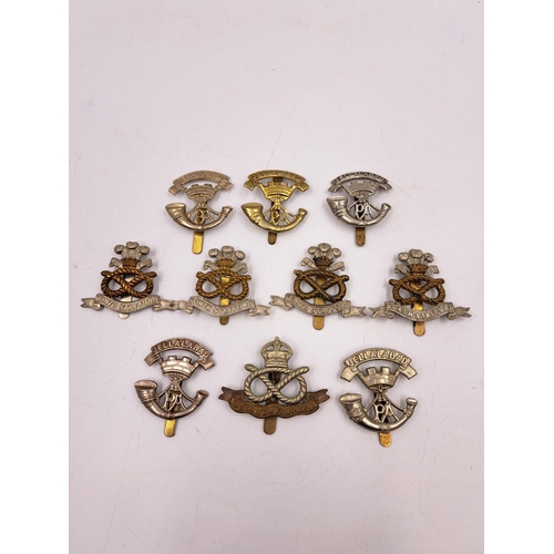 2284 - Ten military cap badges