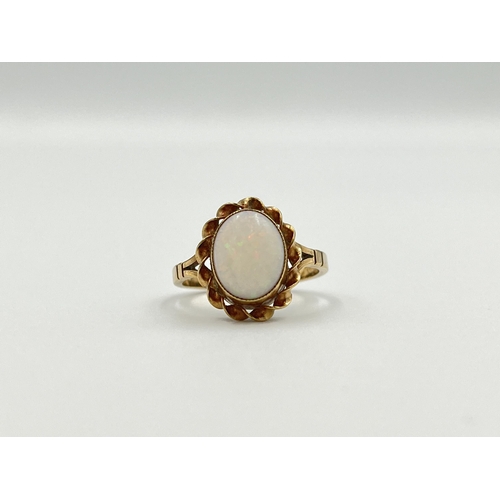 2003 - A yellow metal opal solitaire ring, size K½ - approx. gross weight 2.25g