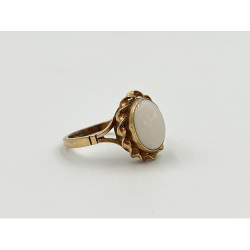 2003 - A yellow metal opal solitaire ring, size K½ - approx. gross weight 2.25g