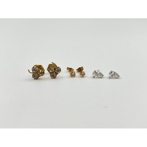 2010 - Three pairs of 9ct gold and CZ earrings - approx. gross weight 1.7g