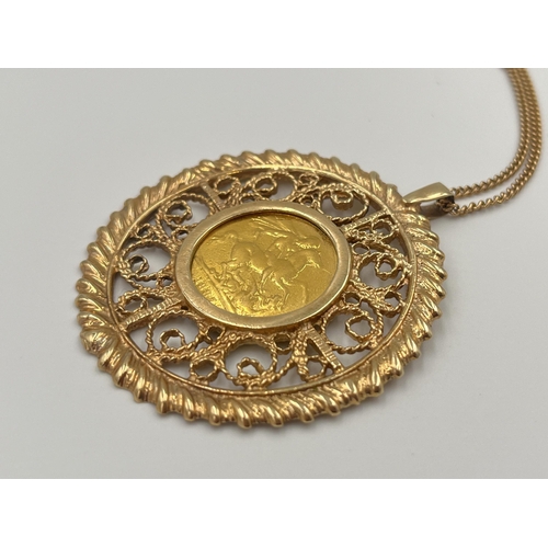 2056 - An 1887 Queen Victoria 22ct gold full sovereign with 9ct gold mount and yellow metal chain - approx.... 