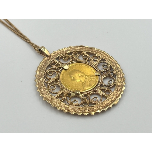 2056 - An 1887 Queen Victoria 22ct gold full sovereign with 9ct gold mount and yellow metal chain - approx.... 