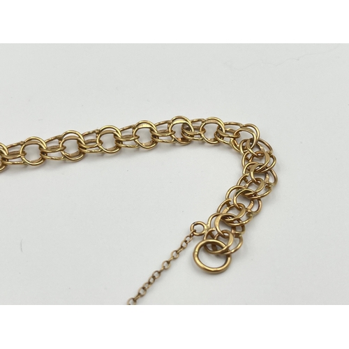 2058 - A hallmarked London 9ct gold bracelet with heart shaped padlock clasp - approx. gross weight 7.8g