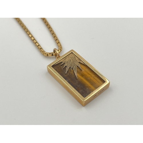 2059 - A hallmarked 9ct gold tiger's eye pendant necklace - approx. weight of chain 7.8g, pendant weight 6.... 