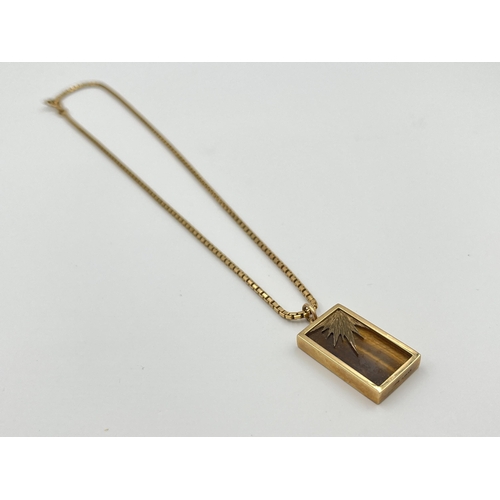 2059 - A hallmarked 9ct gold tiger's eye pendant necklace - approx. weight of chain 7.8g, pendant weight 6.... 