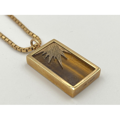 2059 - A hallmarked 9ct gold tiger's eye pendant necklace - approx. weight of chain 7.8g, pendant weight 6.... 