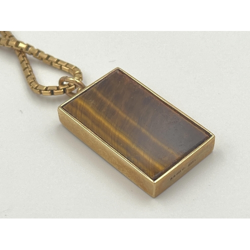 2059 - A hallmarked 9ct gold tiger's eye pendant necklace - approx. weight of chain 7.8g, pendant weight 6.... 