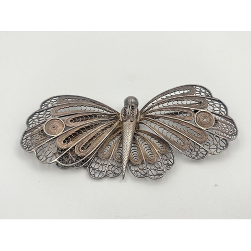 2061 - A white metal filigree butterfly brooch - approx. 10cm wide