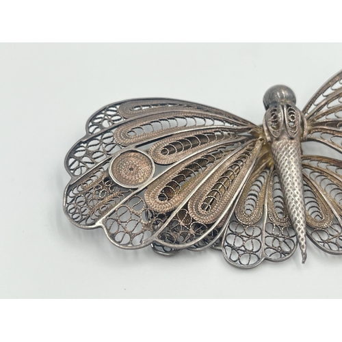 2061 - A white metal filigree butterfly brooch - approx. 10cm wide