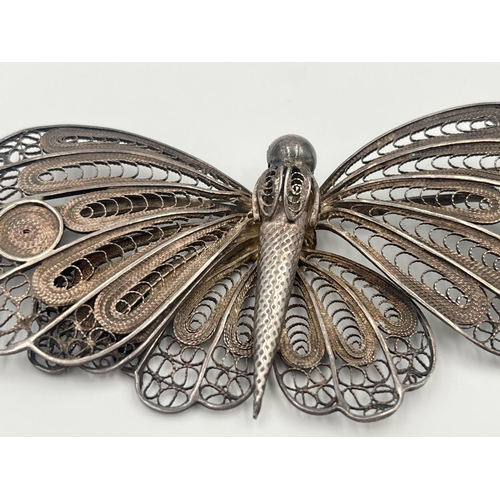 2061 - A white metal filigree butterfly brooch - approx. 10cm wide