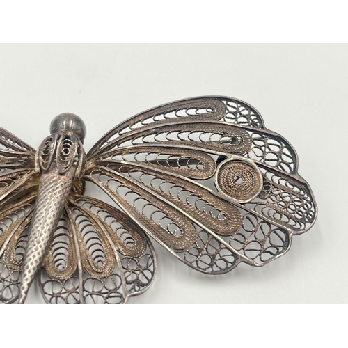 2061 - A white metal filigree butterfly brooch - approx. 10cm wide