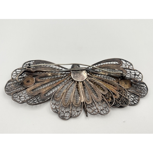 2061 - A white metal filigree butterfly brooch - approx. 10cm wide