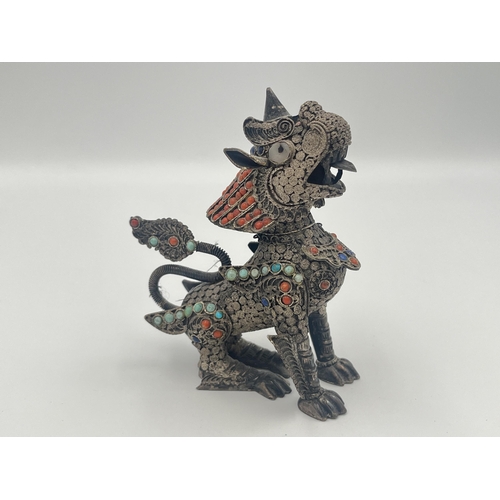 2140 - A Burmese .925 silver filigree chinthe figurine with inset coral and turquoise decoration