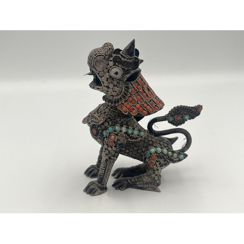 2140 - A Burmese .925 silver filigree chinthe figurine with inset coral and turquoise decoration