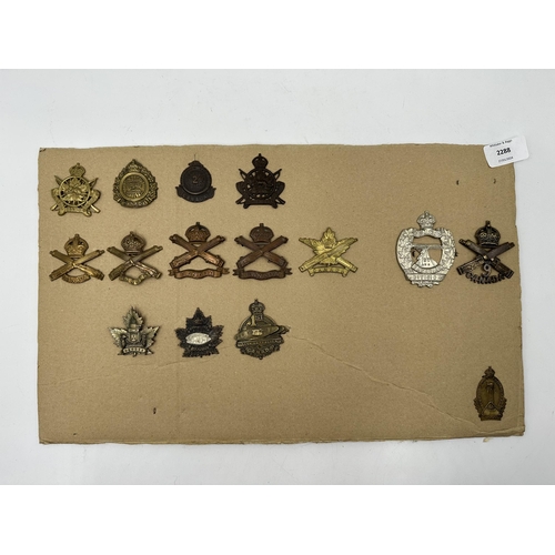 2288 - A collection of military cap badges