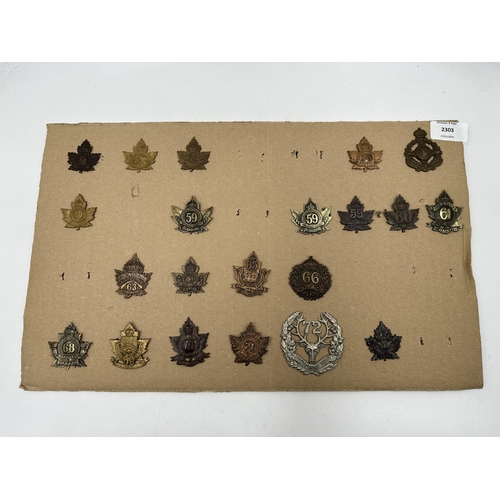 2303 - A collection of military cap badges