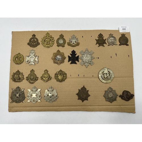 2322 - A collection of military cap badges