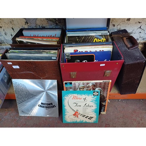 675 - Five record cases containing a collection of vinyl records