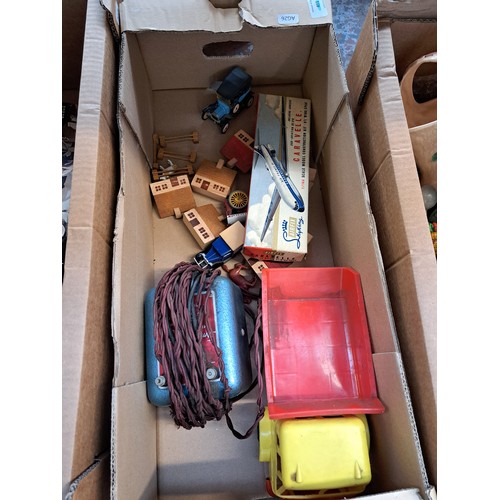 869A - Three boxes containing mid 20th century boxed games, Tudor Rose plastic dumper truck, boxed Airfix S... 