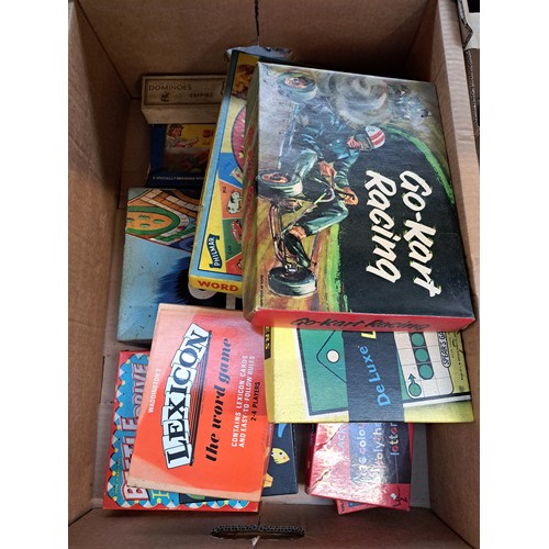 869A - Three boxes containing mid 20th century boxed games, Tudor Rose plastic dumper truck, boxed Airfix S... 