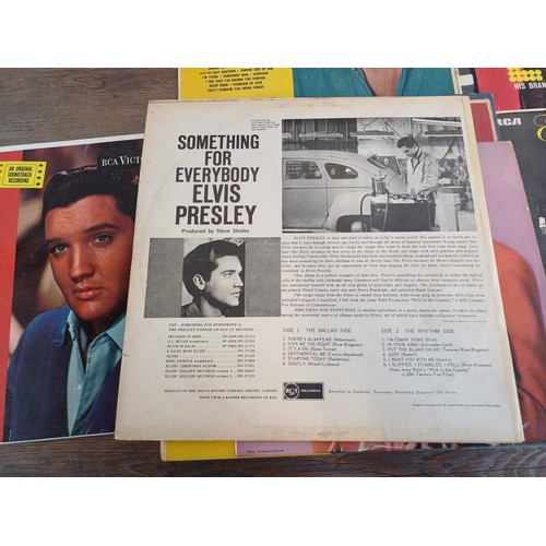 689 - Twenty three Elvis Presley vinyl records to include 'Something For Everybody', 'The Best Of' 10