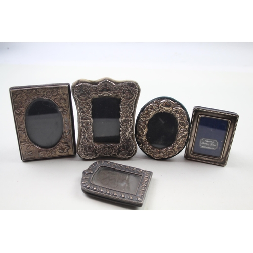 Five .925 sterling silver photo frames - largest approx. 10cm x 8cm