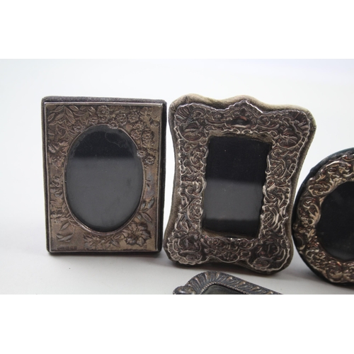 Five .925 sterling silver photo frames - largest approx. 10cm x 8cm