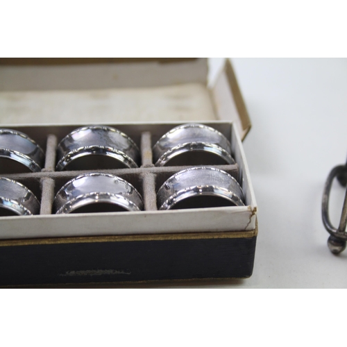 2269 - Seven pieces of silver, one .925 toast rack and a boxed set of six .800 napkin rings - approx. gross... 