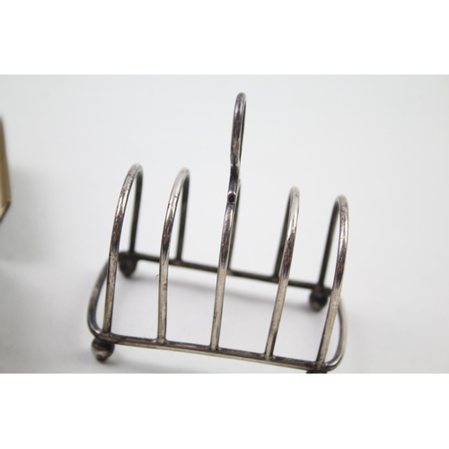 2269 - Seven pieces of silver, one .925 toast rack and a boxed set of six .800 napkin rings - approx. gross... 