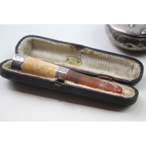 2283 - Three .925 sterling tobacciana items to include snuff box, amber cheroot etc. - approx. gross weight... 