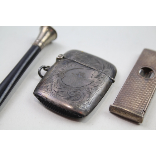 2284 - Four .925 sterling silver tobacciana items to include vesta case, cigar cutter etc. - approx. gross ... 