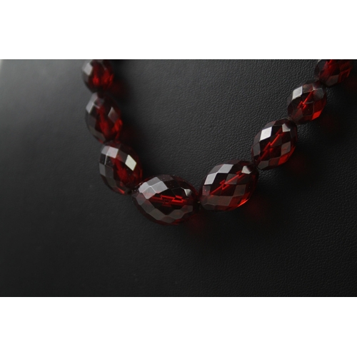 2435 - A faceted prystal cherry bakelite graduated necklace - approx. gross weight 21g