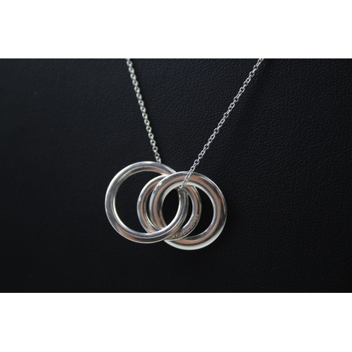 2448 - A Tiffany & Co. silver interlocking pendant necklace - approx. gross weight 5g