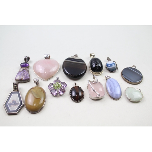 2452 - A collection of silver gemstone set pendants - approx. gross weight 175g