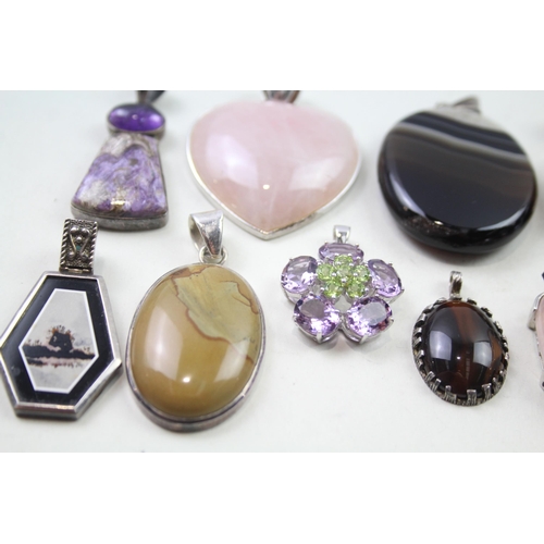 2452 - A collection of silver gemstone set pendants - approx. gross weight 175g