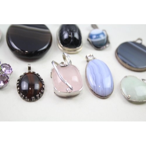 2452 - A collection of silver gemstone set pendants - approx. gross weight 175g