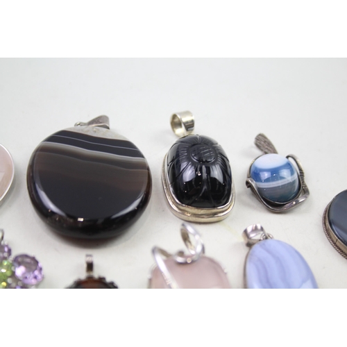 2452 - A collection of silver gemstone set pendants - approx. gross weight 175g